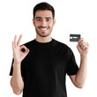 © Damir Khabirov - Young man in black t-shirt, holding credit card and showing OK gesture