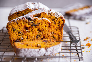 Sweet pumpkin bread with nuts and cranberries, traditional autumn dessert