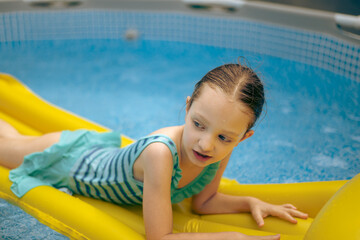 child in pool