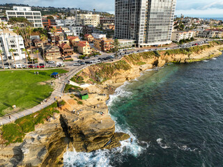 Wall Mural - La Jolla, San Diego, California, from a UAV Aerial Drone looking at Park along the Cliffs with people enjoying the day with a Beautiful Shoreline View