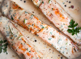 Wall Mural - Cooked salmon fish with cream sauce in frying pan