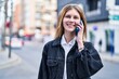 © Krakenimages.com - Young blonde woman smiling confident talking on the smartphone at street