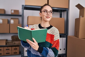 Sticker - Young woman ecommerce business worker writing on notebook at office