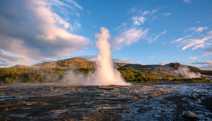 Canvas Print - Stunning Eruption of Strokkur Geysir in Iceland during sunset. Strokkur Geyser Popular touristic location and travel destination of Iceland. Amazing nature landscape