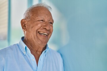 Poster - Senior grey-haired man smiling confident standing at street