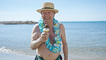 Poster - Senior grey-haired man tourist wearing swimsuit and summer hat holding ice cream at seaside