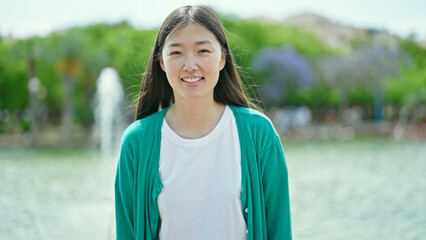 Sticker - Young chinese woman smiling confident standing at park