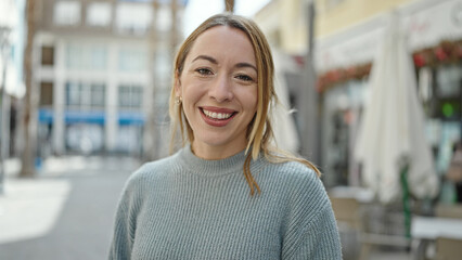 Poster - Young blonde woman smiling confident standing at coffee shop terrace