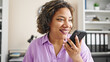 © Krakenimages.com - Young beautiful latin woman business worker sending voice message by smartphone working at office