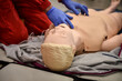 Paramedics simulate emergency intervention on medical training manikin