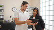 © Krakenimages.com - Man and woman business workers using touchpad working at office