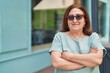 © Krakenimages.com - Senior woman smiling confident standing with arms crossed gesture at street