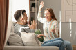 © Pixel-Shot - Angry young woman with money shouting at her husband at home. Domestic violence concept
