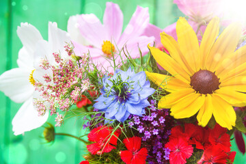 Wall Mural - Beautiful bouquet of wildflowers with bokeh lights - Happy Birthday, Mothers Day greeting card - summer decoration at home