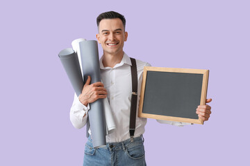 Canvas Print - Male teacher with chalkboard and rolls of paper on lilac background