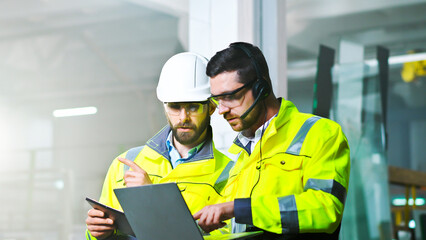 Man working and videochatting on computer at production.