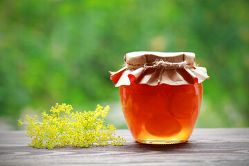 Sticker - Homemade fruit jam in the jar on nature background