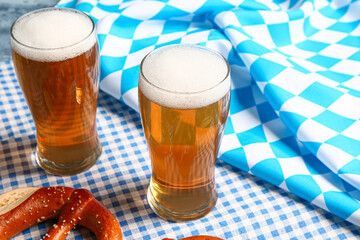 Flag of Bavaria, mugs with beer and pretzel, closeup