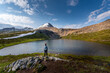 Backpacker Girl admires beautiful Helen Lake and Cirque Peak Banff National Park Alberta