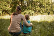 © kieferpix - family mother son bonding in grass nature field. Love, sunlight, togetherness.