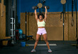 © ADDICTIVE STOCK - Strong black sportswoman lifting heavy dumbbells