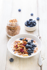 Canvas Print - Homemade granola with fruit nuts and fresh yogurt.