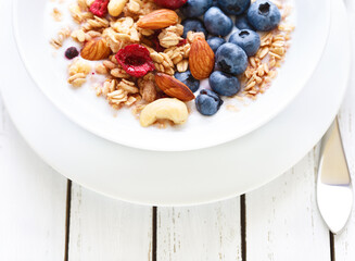 Wall Mural - Homemade granola with fruit nuts and fresh yogurt.