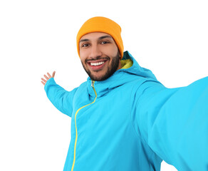 Wall Mural - Smiling young man taking selfie on white background