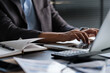 © wattana - Closeup shot of businessman hands typing on laptop keyboard, searching information, browsing. internet.