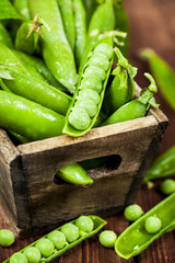 Sticker - Fresh ripe green peas in wooden box