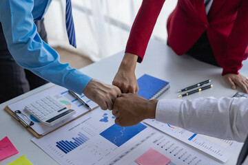 A wide range of company employees in meeting rooms at work A variety of colleagues, fists collide, greet each other, show friendship and respect, remote images.