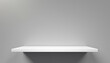 © Uuganbayar - Universal minimalistic background for product presentation. White empty shelf on a light gray wall.