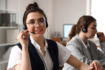 Canvas Print - Female technical support agent  working in office