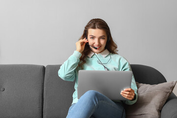 Poster - Female technical support agent with laptop working at home