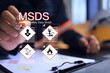 © AREE - Safety officer writing on MSDS or material safety data sheet to indicate chemical information, basic antidotes or hazards to the body in area of use for emergency case safety work concept.