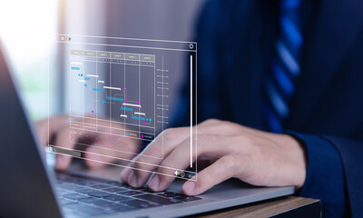 Fototapete - business manager managing business planning project schedules in the office. Gantt chart showing on virtual screen.	
