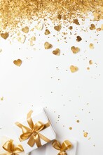 Valentine's Day Concept. Top View Vertical Photo Of Present Boxes Straws Heart Shaped Candles Golden Confetti And Sequins On Isolated White Background - Generative AI