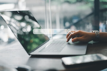 Concept of SEO (search engine optimization) for data searches. Woman's hands typing on laptop keyboard while using web browser to search the internet for information.