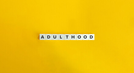 Wall Mural - Adulthood Word on Block Letter Tiles.