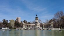 View Of The Large Pond Of The Retiro Park. Buen Retiro Park Boats On The Lake. Rest In The Park.