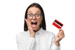 © Damir Khabirov - Excited young woman with mouth open, holding credit card