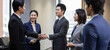 © Blue Jean Images - Successful Chinese business people shaking hands in office