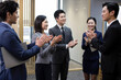 © Blue Jean Images - Cheerful Chinese business people applauding in office