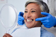© Nadia L/peopleimages.com - Senior woman, teeth and smile for dentist in dental care, appointment or checkup at the clinic. Happy elderly female person smile for tooth whitening, cleaning or oral, mouth and gum care at hospital