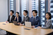 © Blue Jean Images - Confident Chinese business people having a meeting