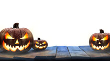Three Lit Jack-o-Lantern, Halloween Pumpkin Lanterns On A Wooden Product Display Table With An Isolated Transparent Background.