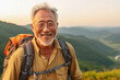 Active retired Asian man hiking outdoors in mountains in summer