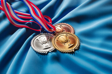 Set of gold, silver and brown medals for winners. First three prizes. Trophies.