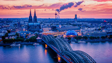 Cologne Koln Germany During Sunset, Cologne Bridge With The Cathedral. Beautiful Sunset At The Rhine River