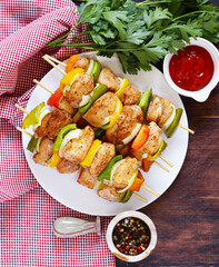 Wall Mural - chicken kebab with onions and bell peppers